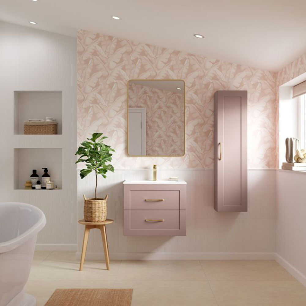 Pink wall-hung bathroom vanity unit with basin and matching tall cabinet