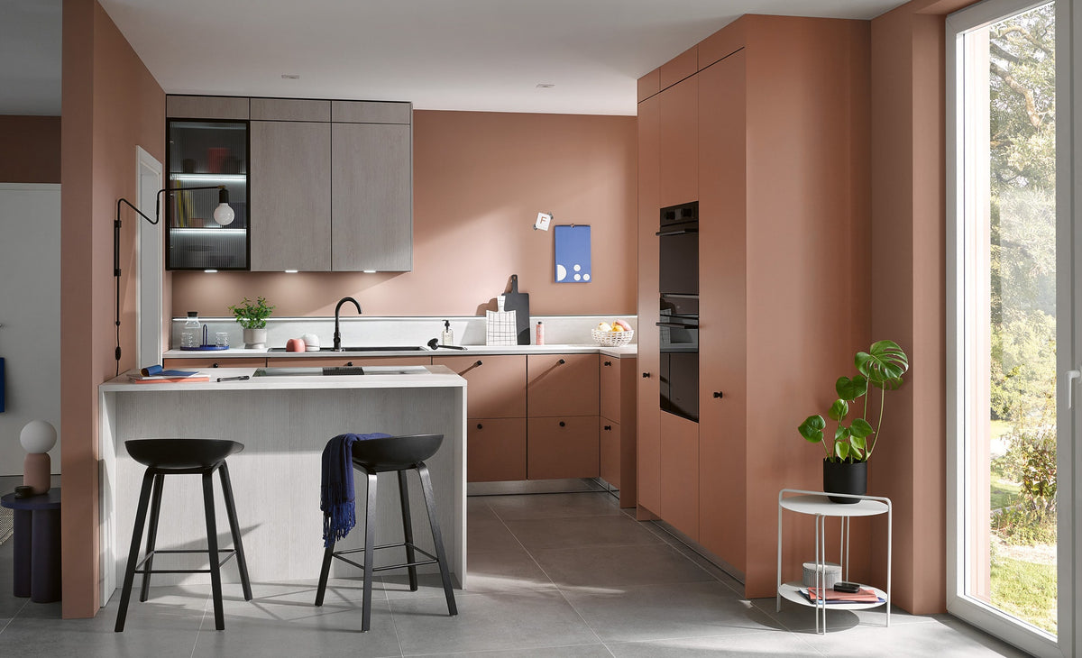 Burger — Blush cabinetry and a breakfast bar