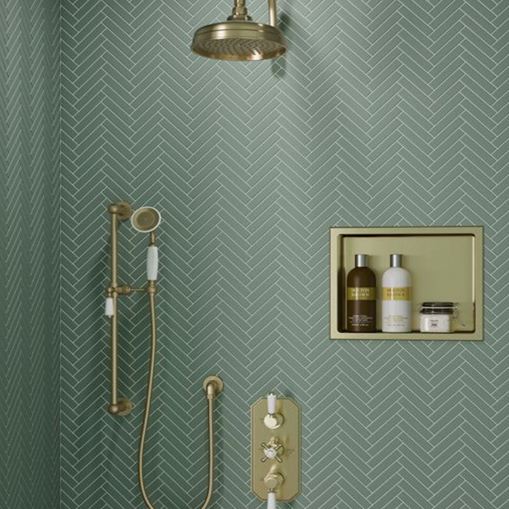 Recessed bathroom storage niche with coordinated shower fittings