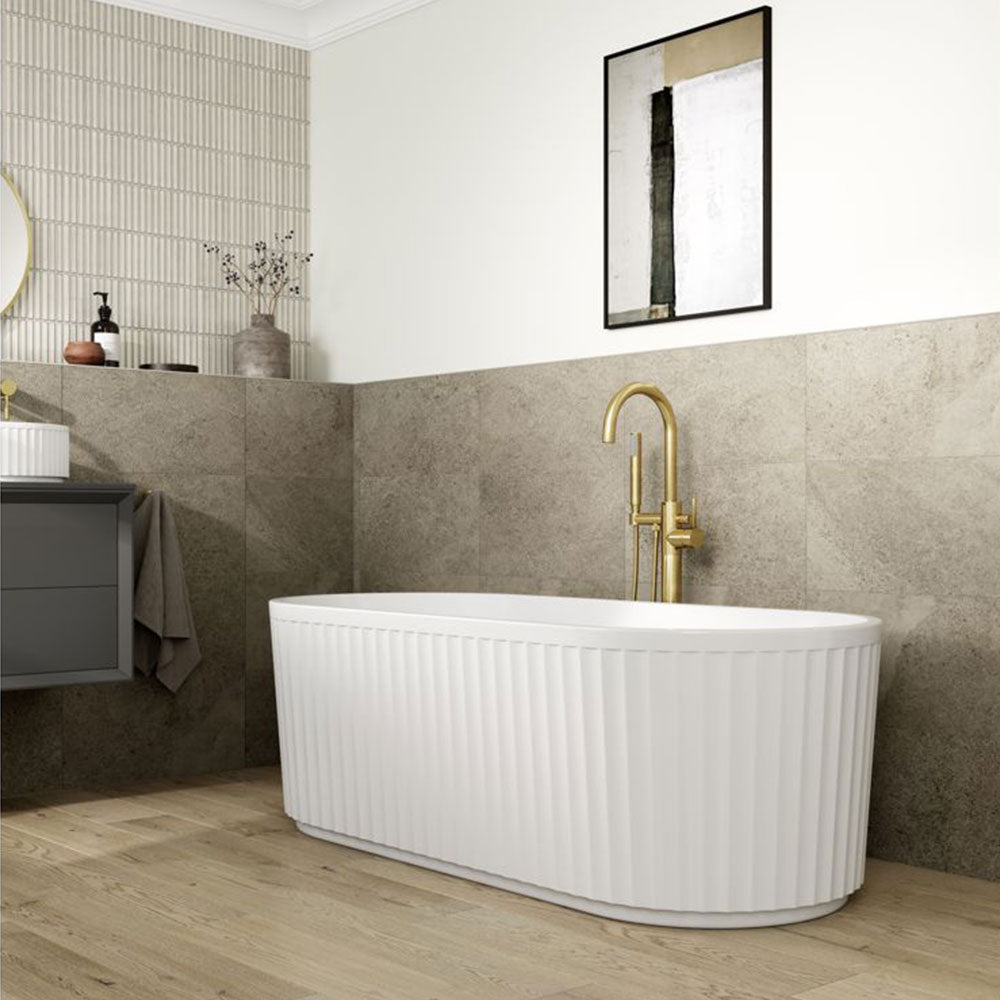 Freestanding bath in a finished tiled bathroom