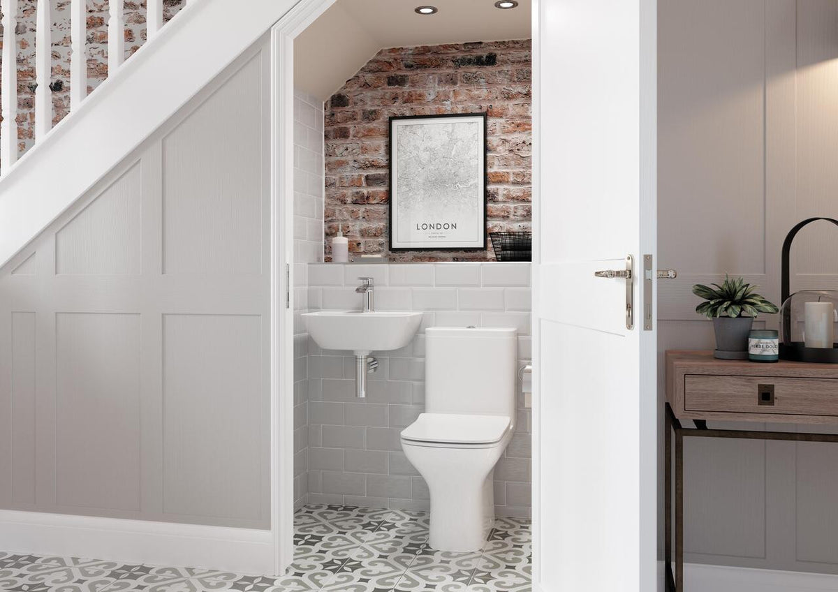 Auvellis Arven Rimless Back To Wall Toilet With Wrapover Soft Close Seat in a bathroom setting