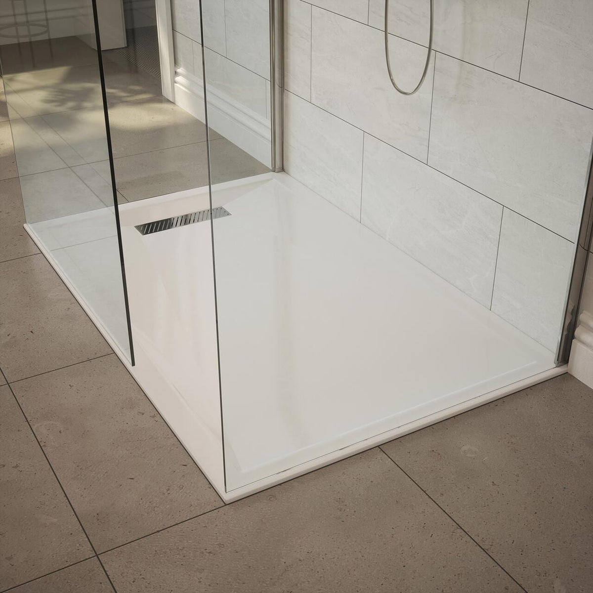 Linear shower tray fitted with Auvellis waste and chrome cover