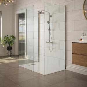 Bathroom with linear shower tray waste and chrome cover