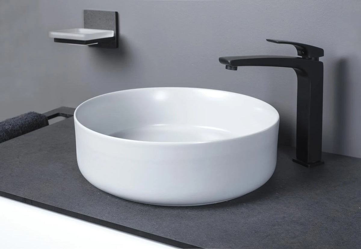 Auvellis Luxey 355mm Round Countertop Washbasin + Waste in a bathroom setting