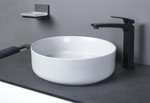 Auvellis Luxey 355mm Round Countertop Washbasin + Waste in a bathroom setting