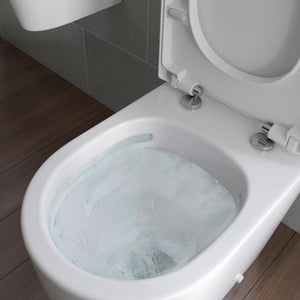 Auvellis Vela Swirlux Short Projection Close Coupled Open Back Toilet With Soft Close Seat in a bathroom setting