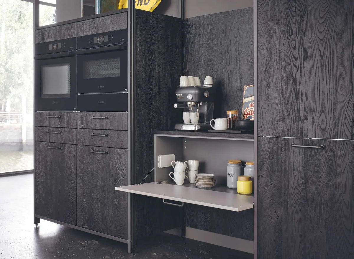 Bauformat — Dark cabinetry with a coffee station