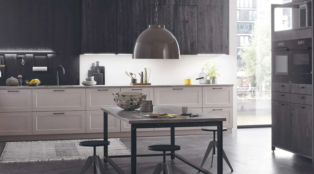 Bauformat — Soft grey cabinetry and dark contrasts