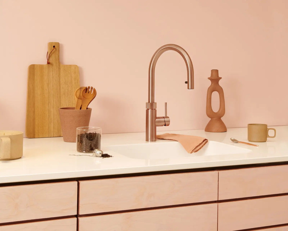 Quooker — Warm metallic tap with blush tones