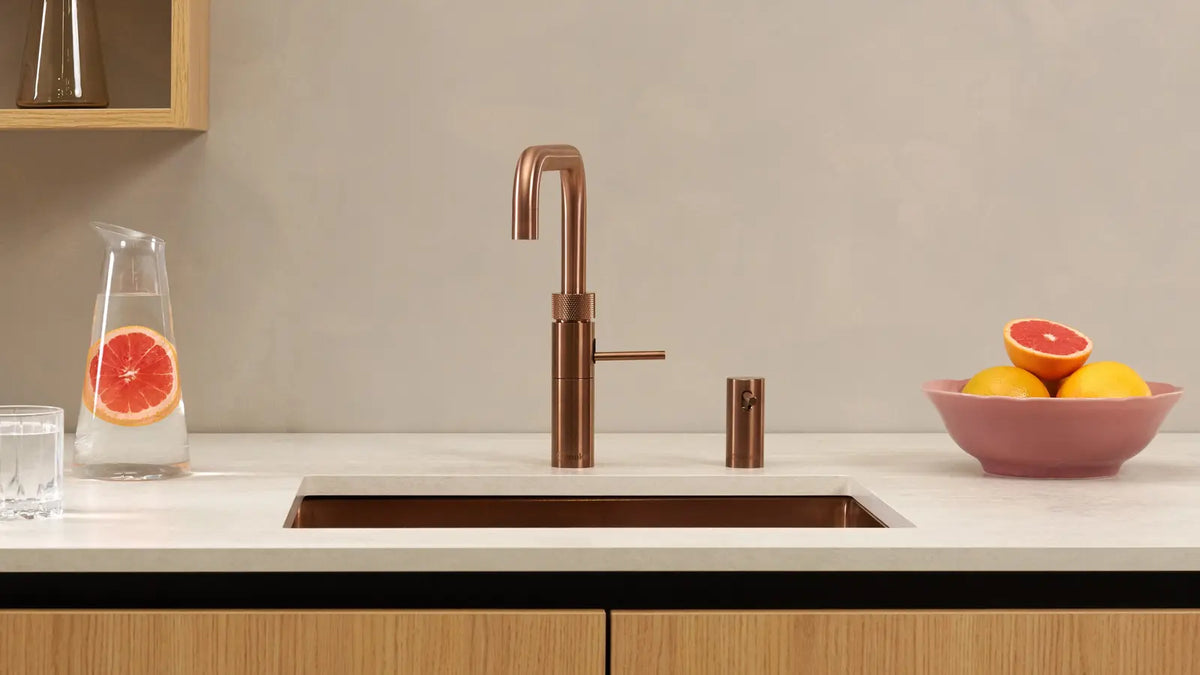 Quooker — A warm metallic tap and matching sink