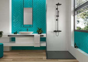 TAU Maiolica Aquamarine Gloss tiles in a herringbone bathroom setting