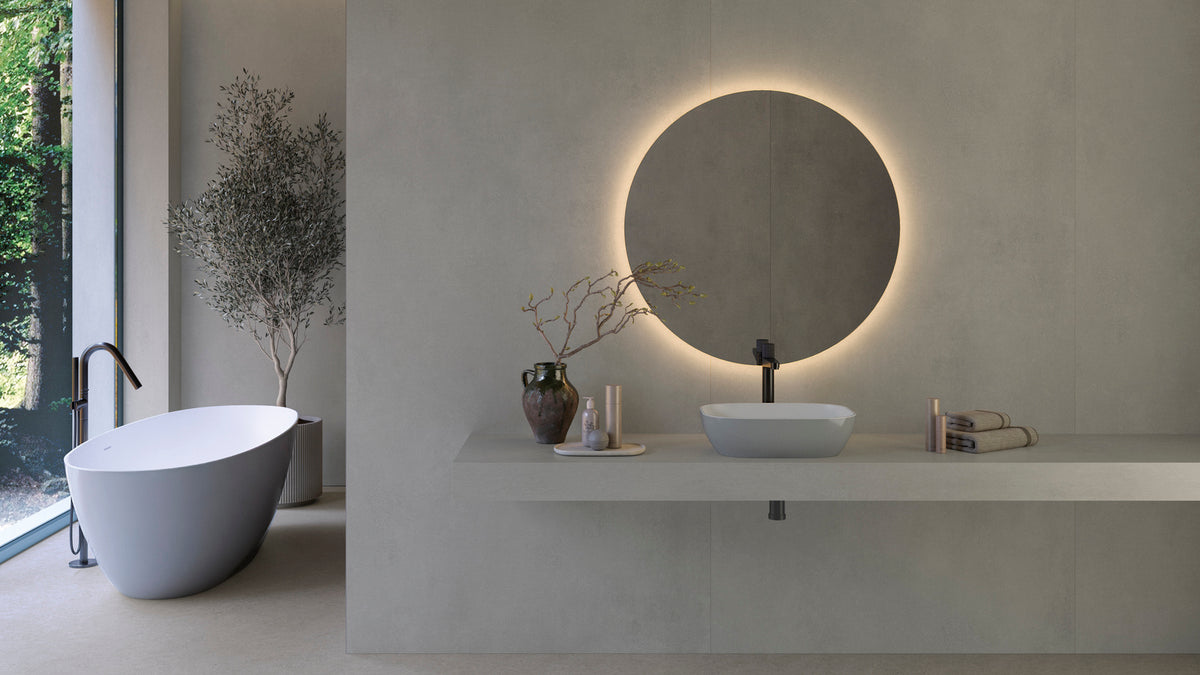 Zenon Ego wall panels with a round illuminated bathroom mirror